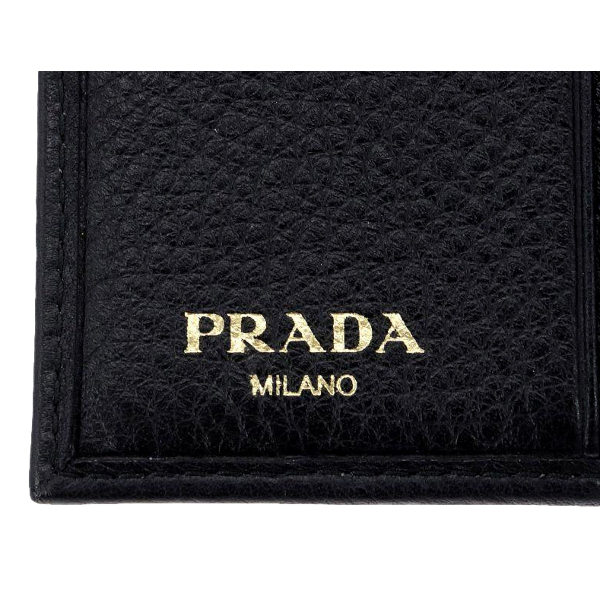 Prada Vitello Grain Black Trifold Compact Wallet Leather Logo Plaque available at Queen Bee of Beverly Hills