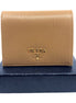 Prada Vitello Move Cipria Beige Leather Bifold Snap Wallet available at Queen Bee of Beverly Hills