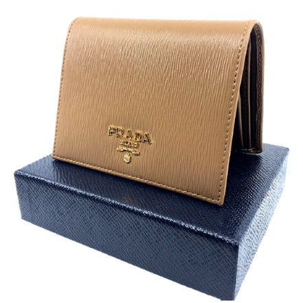 Prada Vitello Move Cipria Beige Leather Bifold Snap Wallet available at Queen Bee of Beverly Hills
