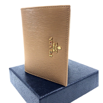 Prada Vitello Move Cipria Beige Leather Bifold Snap Wallet available at Queen Bee of Beverly Hills