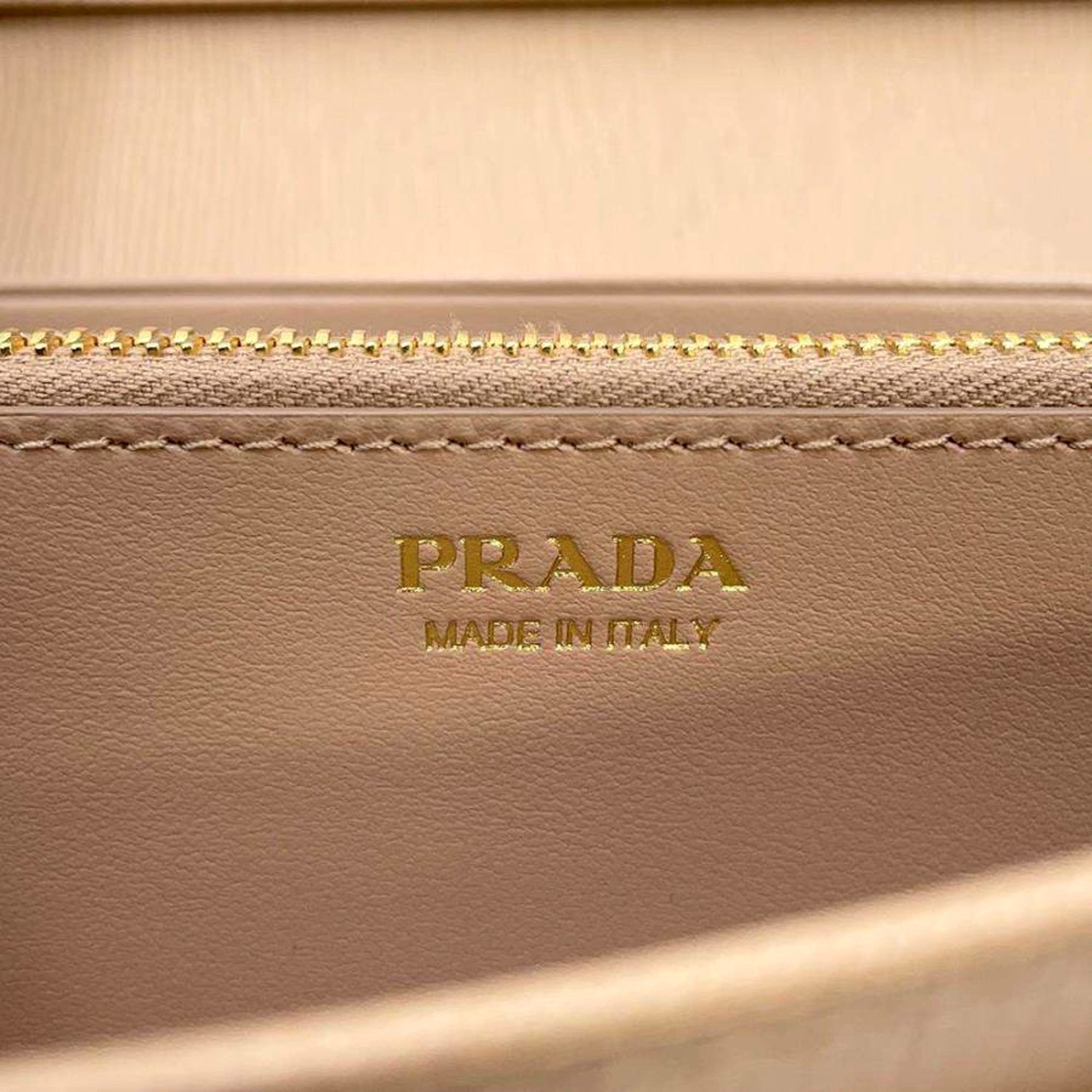 Prada Vitello Move Cipria Beige Leather Continental Long Wallet Gold Triangle Logo available at Queen Bee of Beverly Hills