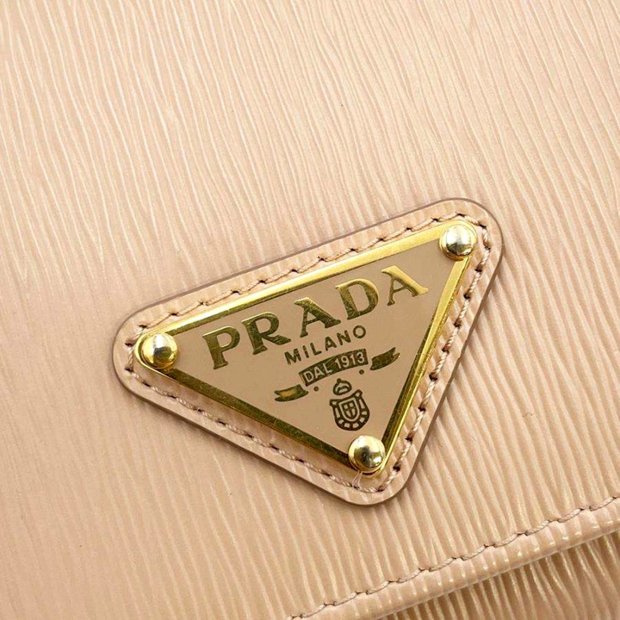 Prada Vitello Move Cipria Beige Leather Continental Long Wallet Gold Triangle Logo available at Queen Bee of Beverly Hills