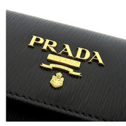 Prada Vitello Move Nero Black Trifold ID Holder Snap Wallet available at Queen Bee of Beverly Hills