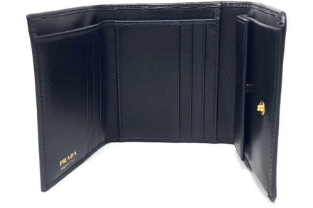 Prada Vitello Move Trifold Compact Wallet Black Leather Triangle Plaque available at Queen Bee of Beverly Hills