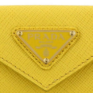 Prada Womens Tri-Fold Saffiano Leather Wallet Sole Yellow Triangle Logo available at Queen Bee of Beverly Hills