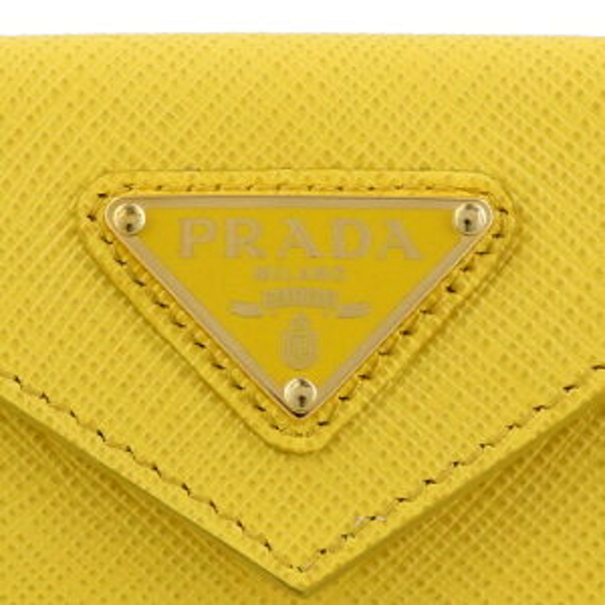 Prada Womens Tri-Fold Saffiano Leather Wallet Sole Yellow Triangle Logo available at Queen Bee of Beverly Hills