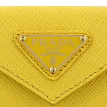 Prada Womens Tri-Fold Saffiano Leather Wallet Sole Yellow Triangle Logo available at Queen Bee of Beverly Hills