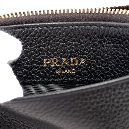 Prada Womens Vitello Grain Nero Black Leather Zip Top Card Wallet available at Queen Bee of Beverly Hills