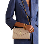 Saint Laurent Cassandre Matelassé Chain Wallet in Beige Grain de Poudre Leather - available at Queen Bee of Beverly Hills. 