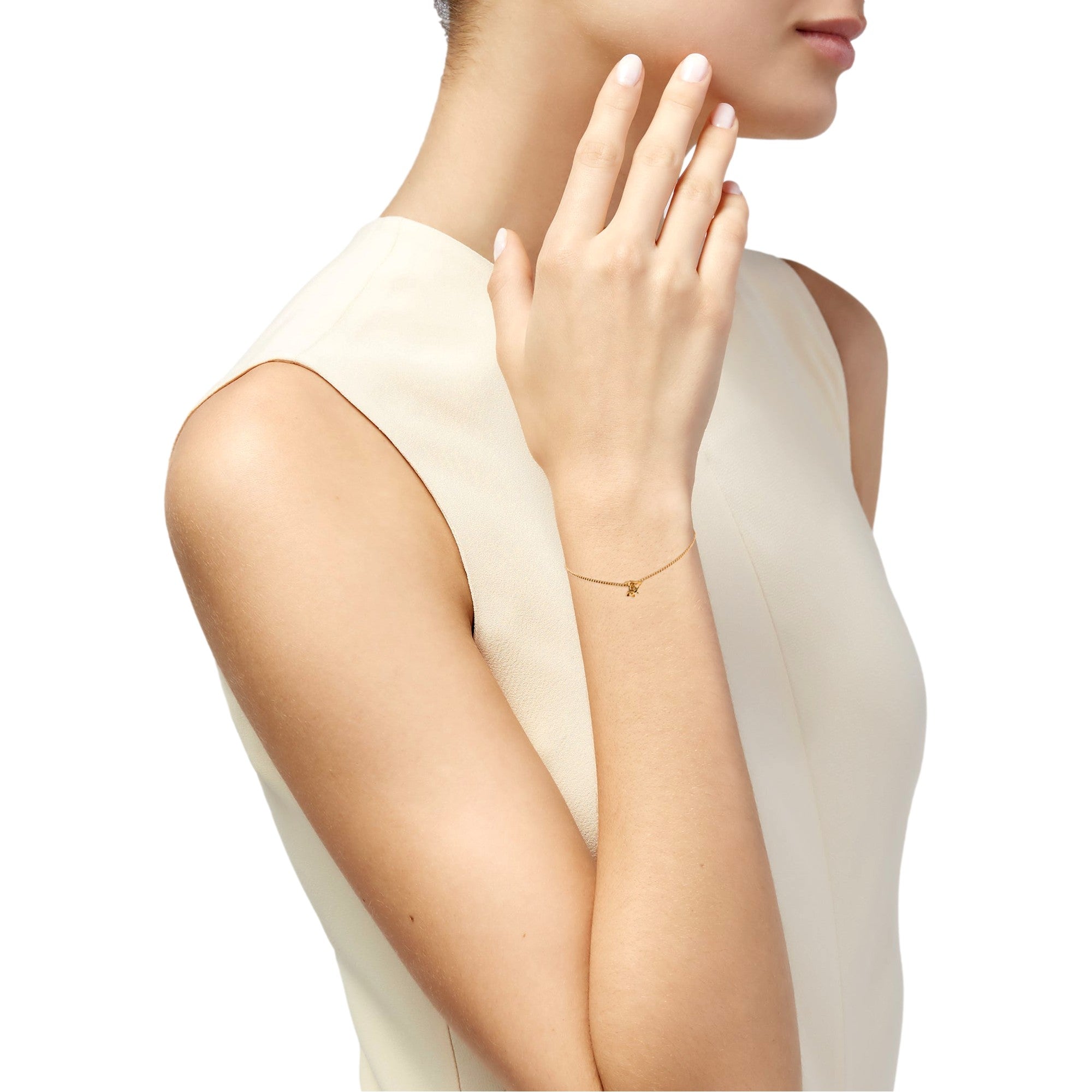 Saint Laurent Monogram Twist Gold Metal Chain Bracelet available at Queen Bee of Beverly Hills