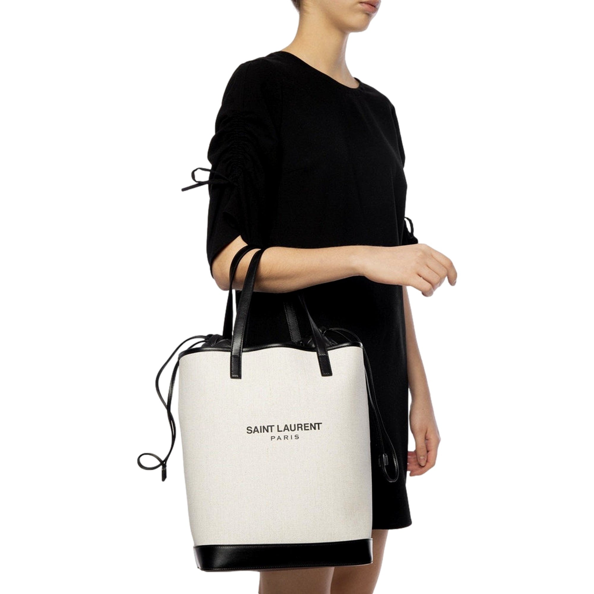 Saint Laurent Teddy White Coated Linen Drawstring Bucket Bag available at Queen Bee of Beverly Hills