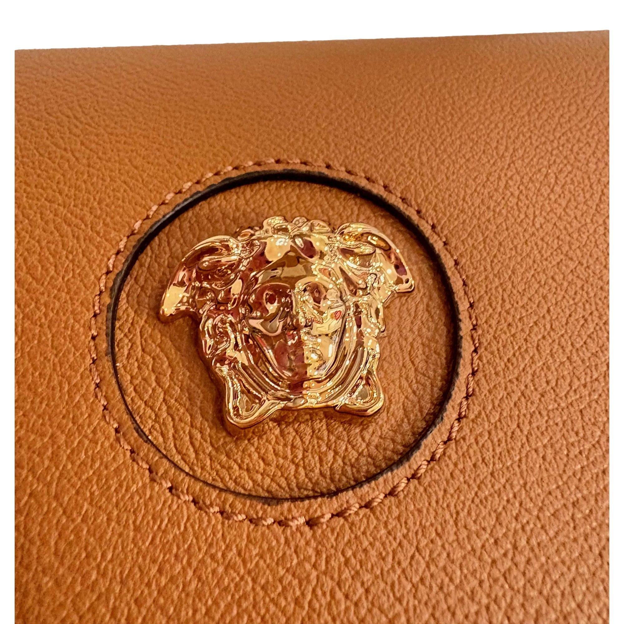 Versace Half-Moon La Medusa Vitello Leather Summer Nude Brown Crossbody Handbag available at Queen Bee of Beverly Hills