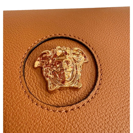 Versace Half-Moon La Medusa Vitello Leather Summer Nude Brown Crossbody Handbag available at Queen Bee of Beverly Hills