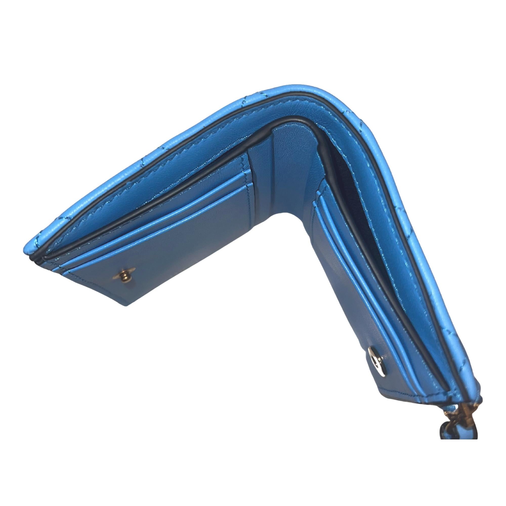 Versace La Medusa Blue Quilted Lamb Leather Compact Snap Wallet available at Queen Bee of Beverly Hills