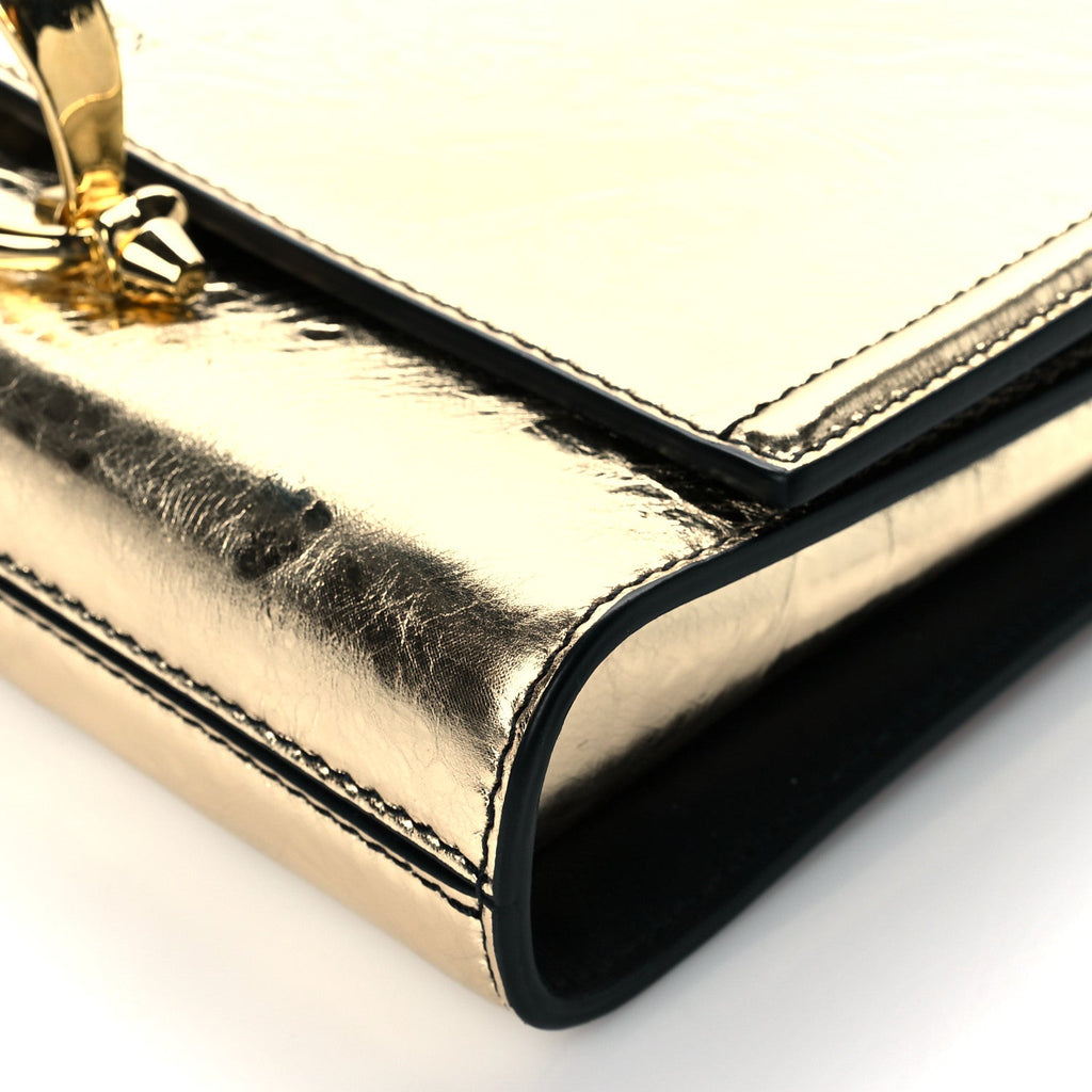 Alexander mcqueen hotsell gold clutch