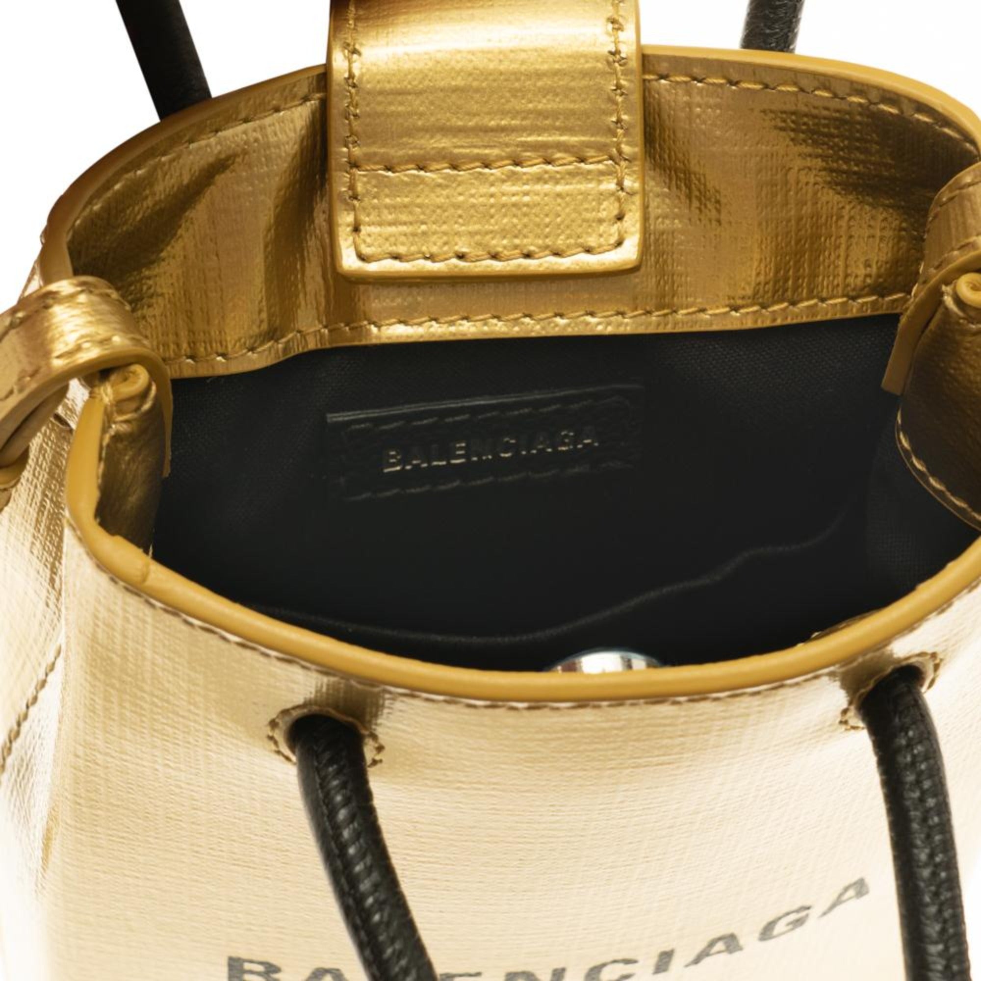 Balenciaga Gold Calfskin Leather Shopper Cross Body Bag available at Queen Bee of Beverly Hills
