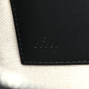 Gucci Black GG Supreme Monogram Tiger Print Clutch Bag available at Queen Bee of Beverly Hills