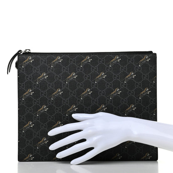 Gucci Black GG Supreme Monogram Tiger Print Clutch Bag available at Queen Bee of Beverly Hills