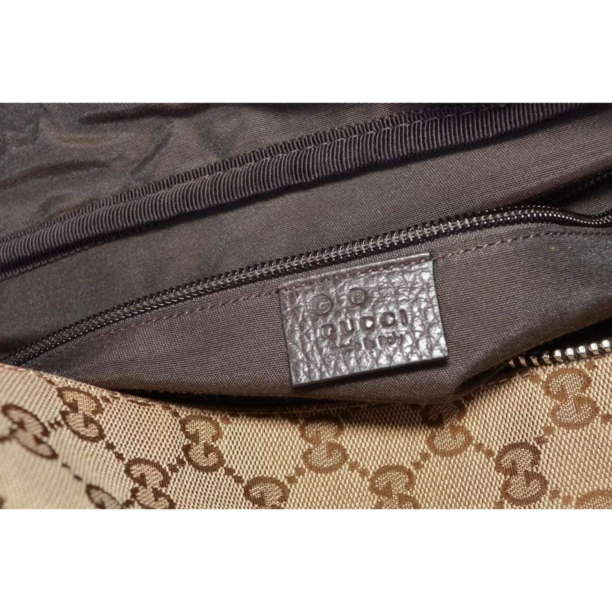 Gucci Large GG Logo Beige Canvas Brown Leather Strap Duffle Bag available at Queen Bee of Beverly Hills