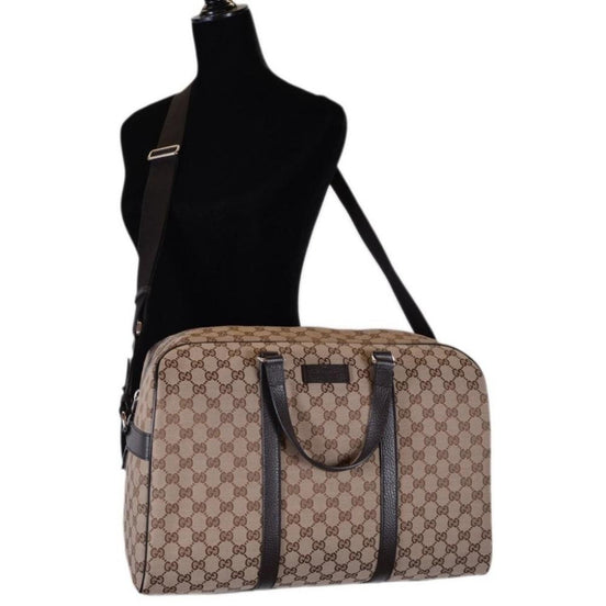 Gucci Large GG Logo Beige Canvas Brown Leather Strap Duffle Bag available at Queen Bee of Beverly Hills