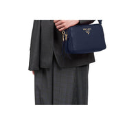 Prada Baltico Blue Vitello Phenix Leather Double Zip Crossbody Bag available at Queen Bee of Beverly Hills