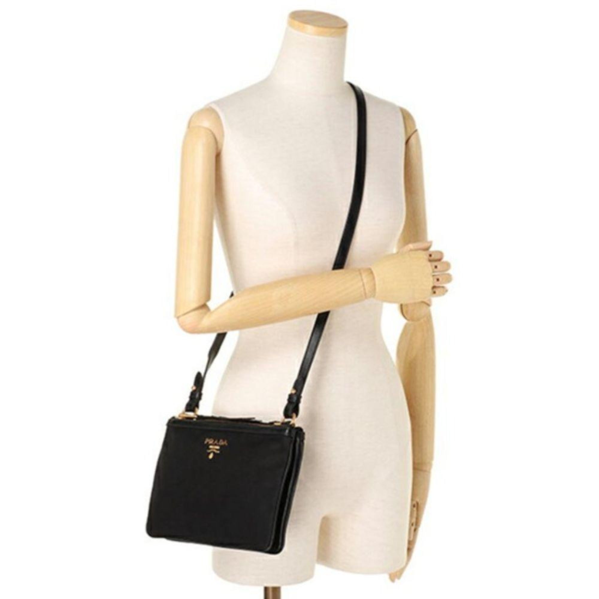 Prada Logo Tessuto Nylon Soft Calf Trim Black Cross Body Bag available at Queen Bee of Beverly Hills