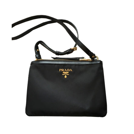 Prada Logo Tessuto Nylon Soft Calf Trim Black Cross Body Bag available at Queen Bee of Beverly Hills
