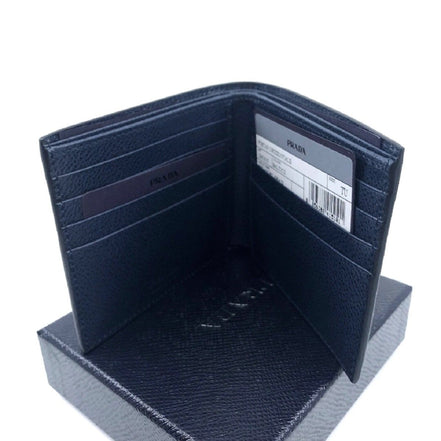 Prada Mens Vitello Micro Grain Navy Blue Leather Triangle Logo Bifold Wallet available at Queen Bee of Beverly Hills