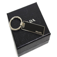 Prada Nero Black Rectangle Enamel Silver Metal Keyring Keychain Charm available at Queen Bee of Beverly Hills