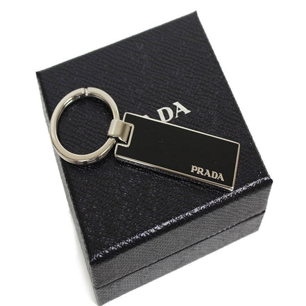Prada Nero Black Rectangle Enamel Silver Metal Keyring Keychain Charm available at Queen Bee of Beverly Hills