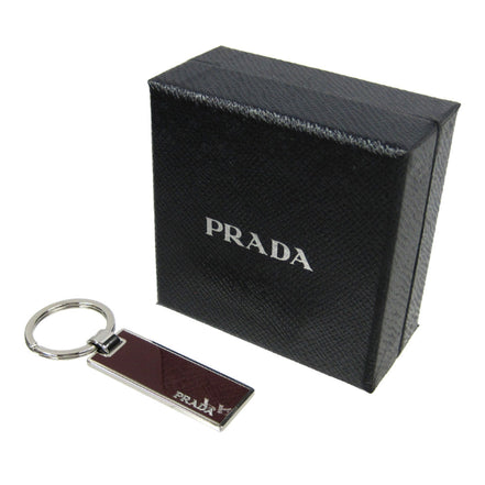 Prada Rubino Red Enamel Silver Metal Keyring Keychain available at Queen Bee of Beverly Hills