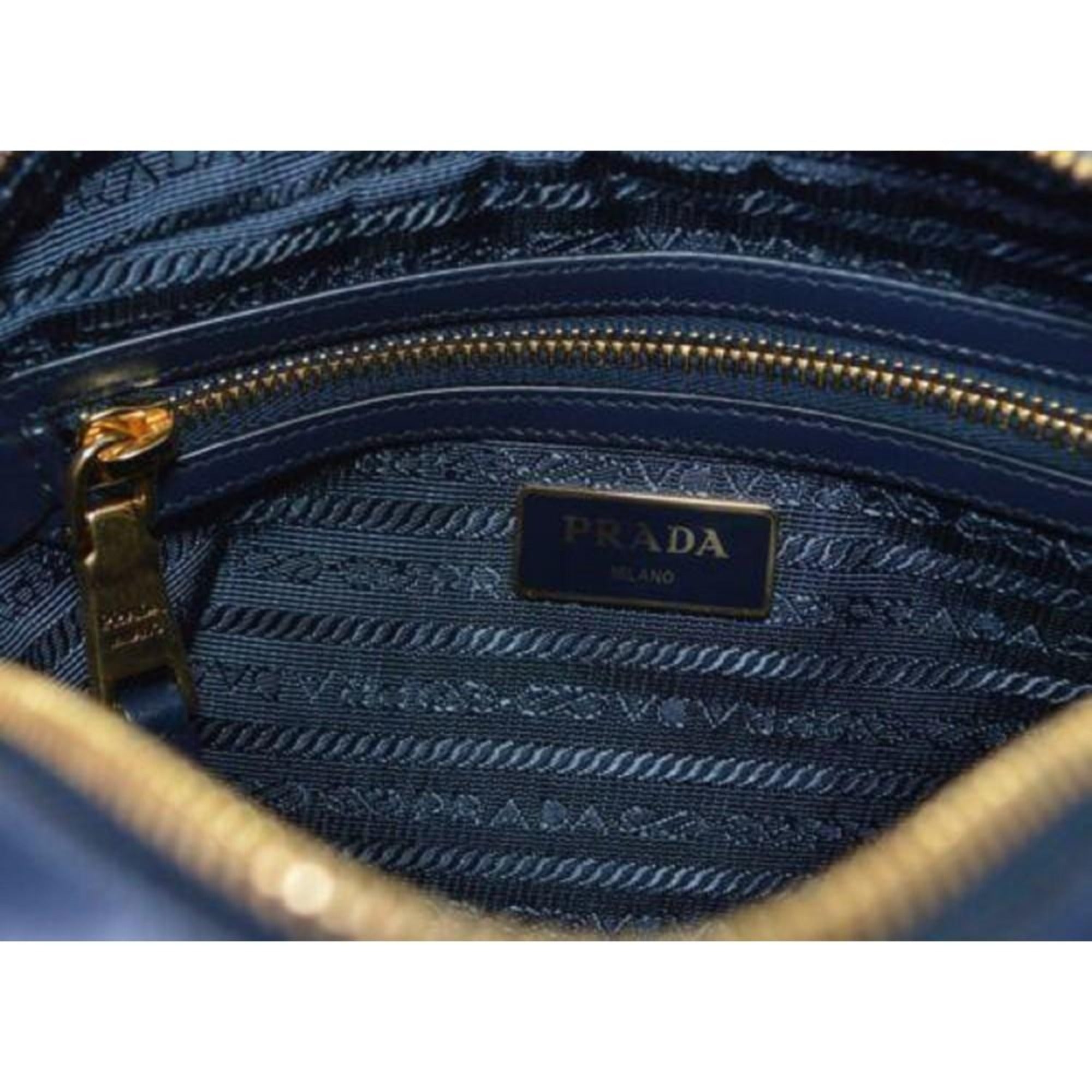 Prada Tessuto Nylon Blue Zip Calf Leather Cross Body Bag available at Queen Bee of Beverly Hills