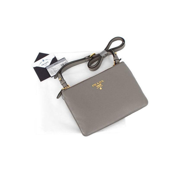Prada Vitello Phenix Argilla Gray Leather Logo Plaque Crossbody Bag available at Queen Bee of Beverly Hills