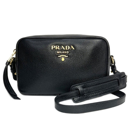 Prada Vitello Phenix Black Leather Gold Logo Camera Crossbody Bag available at Queen Bee of Beverly Hills