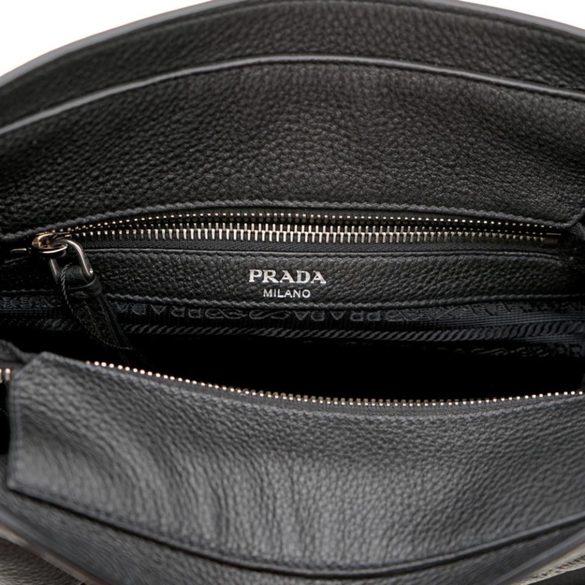 Prada Vitello Phenix Black Leather Web Strap Crossbody Bucket Bag available at Queen Bee of Beverly Hills