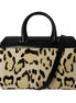 Saint Laurent 12 Hour Calfskin Leather Pony Hair Duffle Bag available at Queen Bee of Beverly Hills