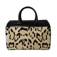 Saint Laurent 12 Hour Calfskin Leather Pony Hair Duffle Bag available at Queen Bee of Beverly Hills